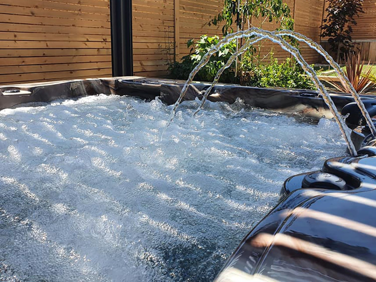 Luxury hot tub with bubbling water and water jets – available in Waterloo, Kitchener, Cambridge & Guelph