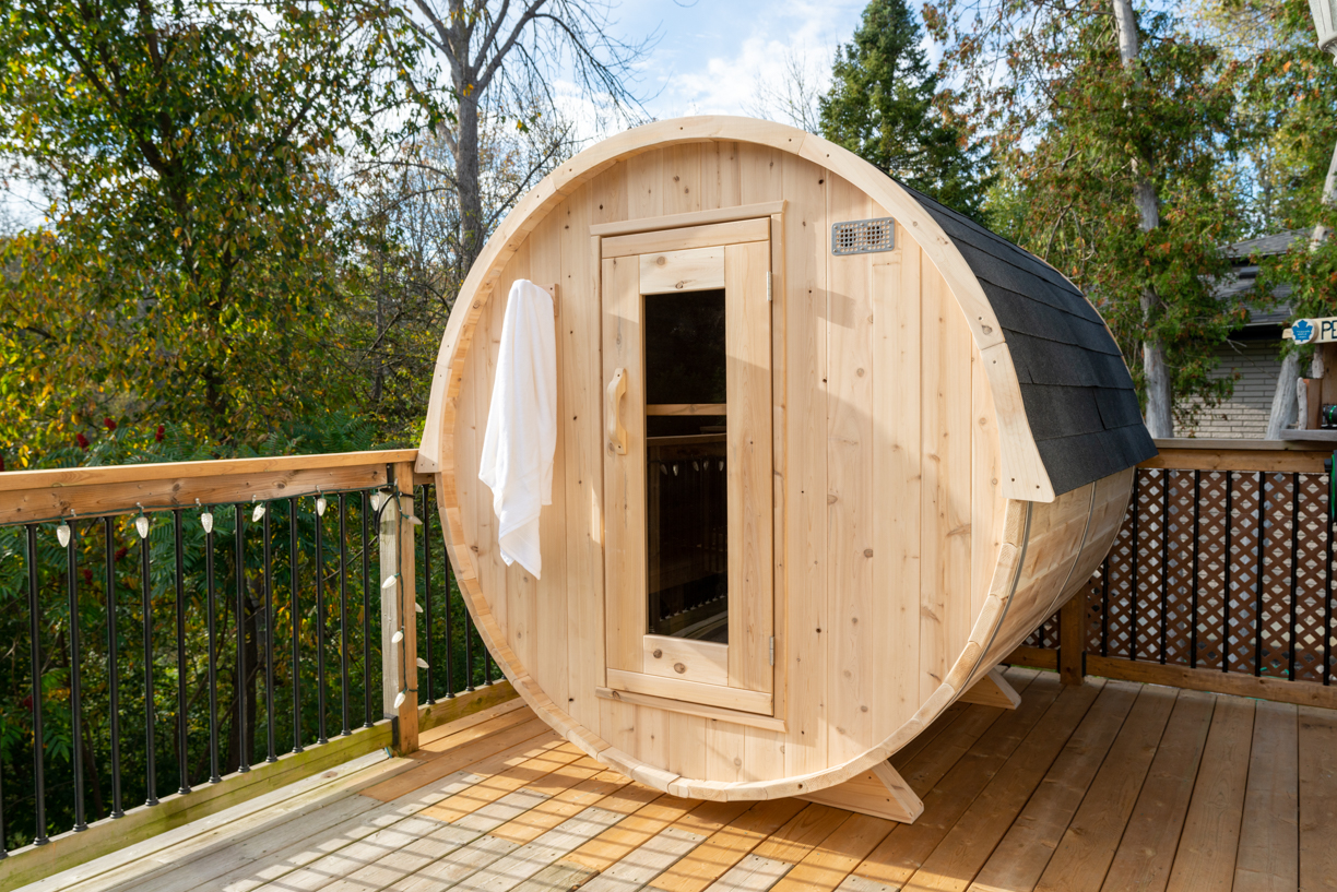 Wooden barrel sauna on deck